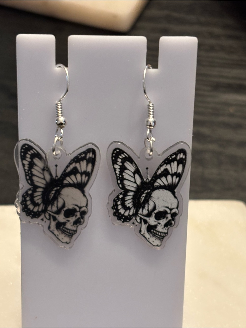 Title: Skull Butterfly Wings Acrylic Dangle Earrings | Gothic Profile Skull Line